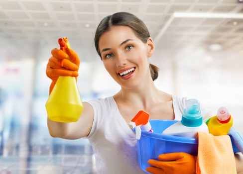 Carpet cleaner preparing equipment with safety gear in a Haringey property